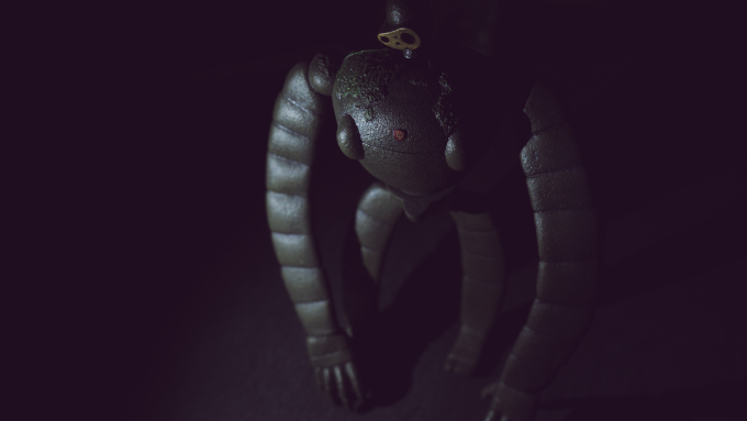 A dark, moody photo of a 3D figurine of a character from the animated Ghibli studio film Castle in the Sky.