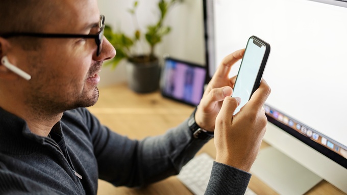 CableWholesale 379268 man desk smartphone image1